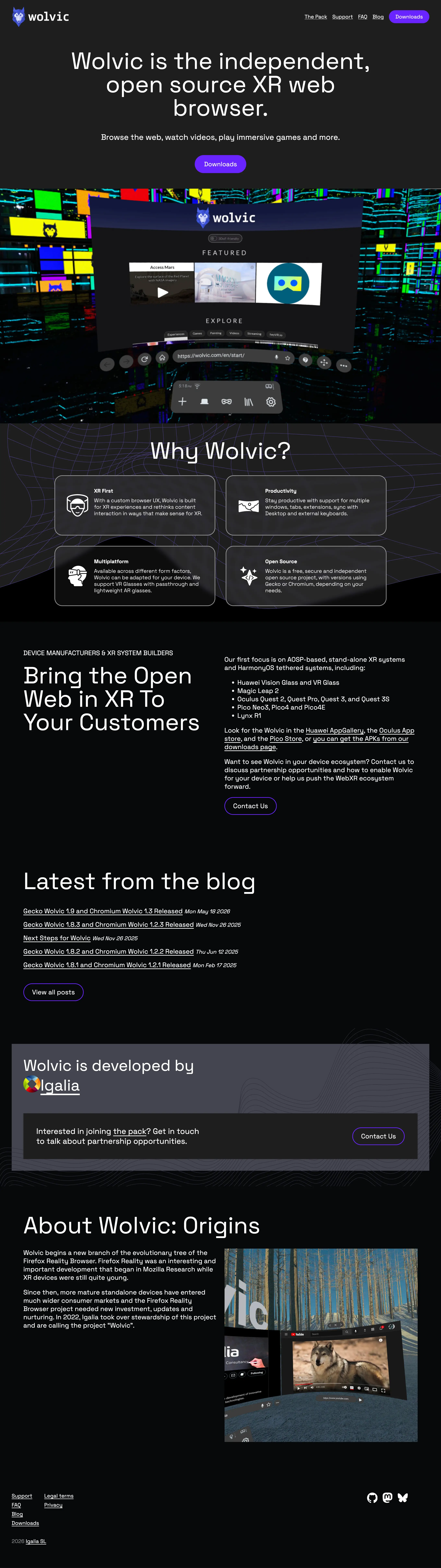 the redesigned Wolvic homepage with a dark layout, product headline, Why Wolvic pillars, device manufacturer section, and blog feed